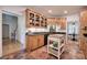Charming kitchen with granite counters, wood cabinets, and brick flooring at 3695 Highway 140, Rydal, GA 30171