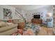 Spacious living room with stylish furniture, decor, and staircase to upper level at 3695 Highway 140, Rydal, GA 30171