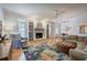 Cozy living room featuring fireplace, built-in shelving, and ample natural light at 3695 Highway 140, Rydal, GA 30171