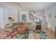 Inviting living room with hardwood floors, plush sectional, and staircase access at 3695 Highway 140, Rydal, GA 30171