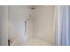 Modern shower features white geometric tiles, two shower heads, and white shower curtain at 3695 Highway 140, Rydal, GA 30171