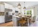 Stylish kitchen features stainless steel appliances, white cabinets, and quartz countertops at 200 Starr Cir, Stockbridge, GA 30281