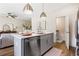 Stylish kitchen with stainless steel appliances, gray cabinetry and quartz countertops at 200 Starr Cir, Stockbridge, GA 30281