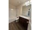 Clean bathroom with vanity, granite countertop, and tub/shower combo at 2335 Hackamore Dr, Atlanta, GA 30349
