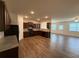 Open kitchen layout with hardwood floors, stainless steel appliances, and adjacent living space at 2335 Hackamore Dr, Atlanta, GA 30349