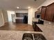 Open concept kitchen features granite counters, backsplash, and wood flooring at 2335 Hackamore Dr, Atlanta, GA 30349