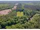 Expansive aerial view of lush, wooded land, creek, and a cleared area perfect for building at 2520 Hollonville, Brooks, GA 30205