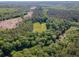 Expansive aerial view of lush, wooded land, creek, and a cleared area perfect for building at 2520 Hollonville, Brooks, GA 30205