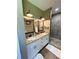 Bathroom featuring double sinks with granite counters and a tiled shower at 2520 Hollonville, Brooks, GA 30205