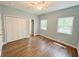 Bedroom featuring hardwood floors, two windows, and a large closet at 2520 Hollonville, Brooks, GA 30205