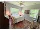 Bedroom featuring hardwood floors, three windows and vintage decor at 2520 Hollonville, Brooks, GA 30205