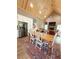 Open-concept kitchen, dining, and living area with vaulted wood ceilings and stainless steel appliances at 2520 Hollonville, Brooks, GA 30205
