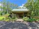 Charming single-story home with a covered porch and a beautiful, well-maintained garden at 2520 Hollonville, Brooks, GA 30205