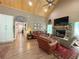 Cozy living room featuring a stone fireplace, vaulted ceilings, and comfortable leather furniture at 2520 Hollonville, Brooks, GA 30205