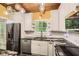 Modern kitchen with stainless steel appliances, granite countertops, and ample cabinet space at 2648 Woodacres Ne Rd, Atlanta, GA 30345