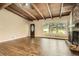 Spacious living room featuring hardwood floors, a cozy fireplace, and an abundance of natural light at 2648 Woodacres Ne Rd, Atlanta, GA 30345