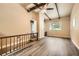 Open-concept living area with vaulted ceilings, wood beams and tons of natural light at 2648 Woodacres Ne Rd, Atlanta, GA 30345