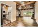 Open-concept living room featuring hardwood floors, a fireplace, and a seamless flow to the kitchen at 2648 Woodacres Ne Rd, Atlanta, GA 30345