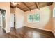 Cozy main bedroom with hardwood floors and natural light coming through the windows at 2648 Woodacres Ne Rd, Atlanta, GA 30345