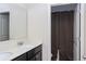 Well-lit bathroom featuring a double sink vanity with a white countertop and a separate shower with a stylish dark shower curtain at 3013 Nicholas Dr, Villa Rica, GA 30180