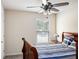 Bedroom with blue and white bedding and a window at 3013 Nicholas Dr, Villa Rica, GA 30180