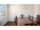 Dining room featuring decorative wainscoting, hardwood floors, and natural light at 3013 Nicholas Dr, Villa Rica, GA 30180