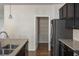 Well-equipped kitchen with stainless steel appliances, granite countertops, and a walk-in pantry for ample storage at 3013 Nicholas Dr, Villa Rica, GA 30180