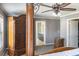 Stylish main bedroom featuring a decorative armoire and an ensuite bathroom at 3013 Nicholas Dr, Villa Rica, GA 30180