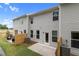 Backyard showing the patio, fencing and siding of this townhome at 344 Navigator Ln, Mcdonough, GA 30253