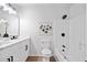 Bright bathroom with double vanity, modern fixtures, and a combination tub and shower at 4058 Daron Ct, Ellenwood, GA 30294