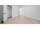 Bedroom with wood-look floors, fresh paint, and a view to another room at 4058 Daron Ct, Ellenwood, GA 30294