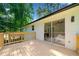 Large wooden deck with sliding glass door access to the home's interior at 4058 Daron Ct, Ellenwood, GA 30294