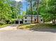 Charming two-story home with a two-car garage, long driveway, and landscaped front yard at 4058 Daron Ct, Ellenwood, GA 30294