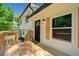Charming home featuring a welcoming wooden porch, black front door, and stylish wood-accented shutters at 4058 Daron Ct, Ellenwood, GA 30294
