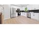Bright kitchen with white cabinetry, stainless steel appliances, and modern backsplash at 4058 Daron Ct, Ellenwood, GA 30294