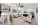 Bright living room featuring a modern ceiling fan, open floor plan, and stylish decor at 4058 Daron Ct, Ellenwood, GA 30294