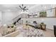 Spacious living room with high ceilings, ceiling fan and stylish decor at 4058 Daron Ct, Ellenwood, GA 30294