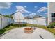 Fenced backyard featuring an outdoor trampoline, fire pit and pea gravel at 1043 Lexus Dr, Lawrenceville, GA 30045