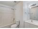 Well-lit bathroom featuring a tub and shower combo, toilet, and vanity with mirror at 1043 Lexus Dr, Lawrenceville, GA 30045
