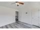 Bedroom with gray wood flooring leading to the stairs at 1043 Lexus Dr, Lawrenceville, GA 30045