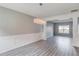 Open dining room with modern light fixture, wainscoting, and beautiful flooring at 1043 Lexus Dr, Lawrenceville, GA 30045