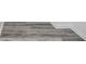 A close-up of newly installed, gray, wood-look flooring at 1043 Lexus Dr, Lawrenceville, GA 30045