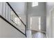 Bright foyer with tall ceilings, staircase, and light walls highlighting natural light at 1043 Lexus Dr, Lawrenceville, GA 30045