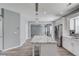 Open kitchen area featuring a center island, stainless steel appliances, and updated cabinets and countertops at 1043 Lexus Dr, Lawrenceville, GA 30045