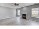 Bright living room showcasing a cozy fireplace, new floors, recessed lights, and updated paint at 1043 Lexus Dr, Lawrenceville, GA 30045