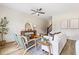 Bright living room with hardwood floors, neutral decor, comfortable seating, and ample natural light at 201 Starr Cir, Stockbridge, GA 30281