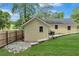 Exterior view of home's backyard featuring siding, landscaping, and wooden fence at 2084 Bethel Nw Dr, Atlanta, GA 30314