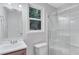 Bathroom featuring modern fixtures, and a glass enclosed shower over the toilet at 2084 Bethel Nw Dr, Atlanta, GA 30314