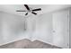 Bedroom featuring neutral walls, carpet, ceiling fan, and a pair of white doors at 2084 Bethel Nw Dr, Atlanta, GA 30314