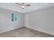 Bedroom featuring a ceiling fan, carpeted floor, and natural light from a window at 2084 Bethel Nw Dr, Atlanta, GA 30314
